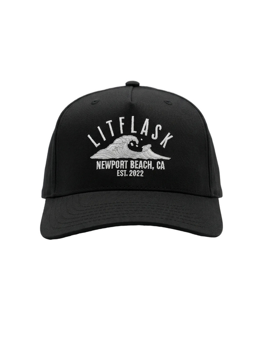 Black cap with white text and wave graphic on a white background